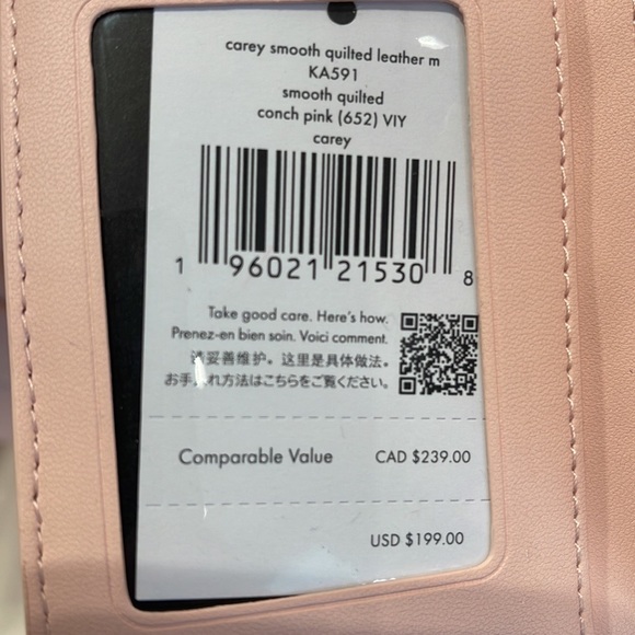 Kate Spade Carey Medium Compartment Bifold Wallet
COLOR: Conch Pink - Picture 9 of 16